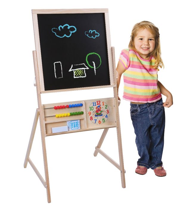 confident child drawing on a large double-sided chalkboard with vibrant chalk
