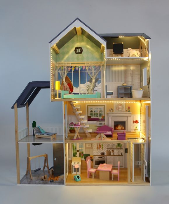playful shot of the wooden dollhouse with glowing led lights illuminating the cozy living room and terrace
