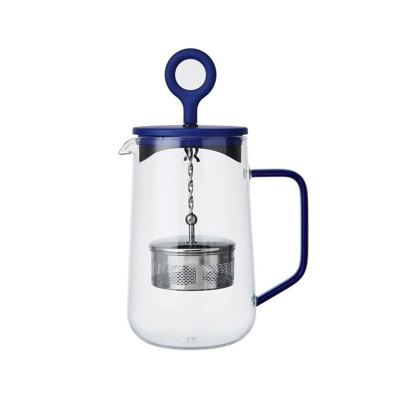 soft morning light on a blue gyro teapot, steam rising from its elegant glass infuser