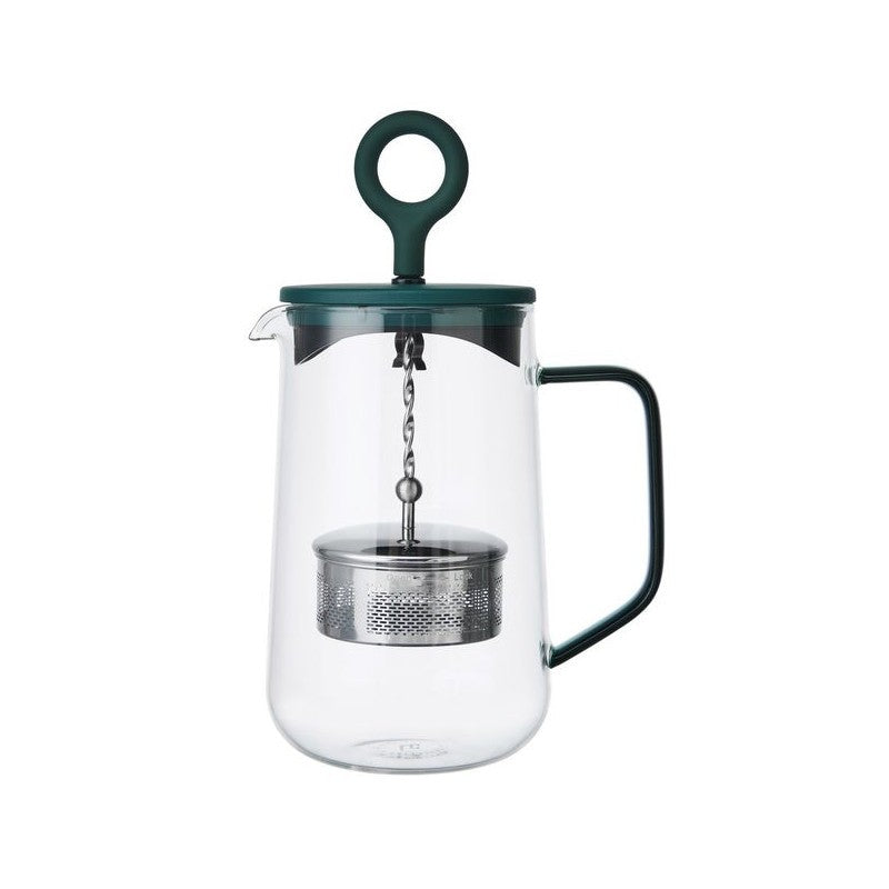 bold green gyro teapot with a dramatic swirl of tea leaves in its glass infuser