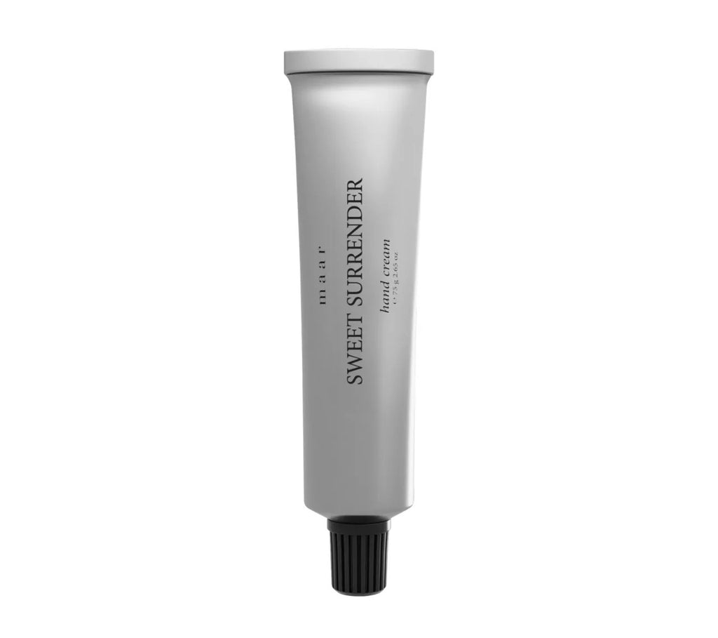 bold close-up of sweet surrender hand cream tube with a luxurious sheen