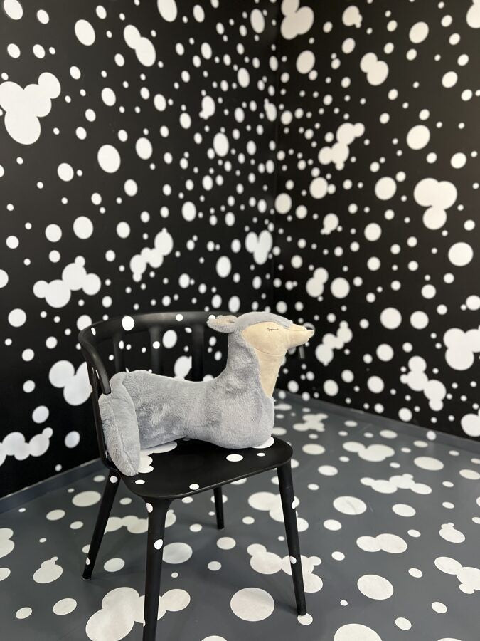 elegant grey wolf pillow in soft morning light, a sophisticated nursery companion