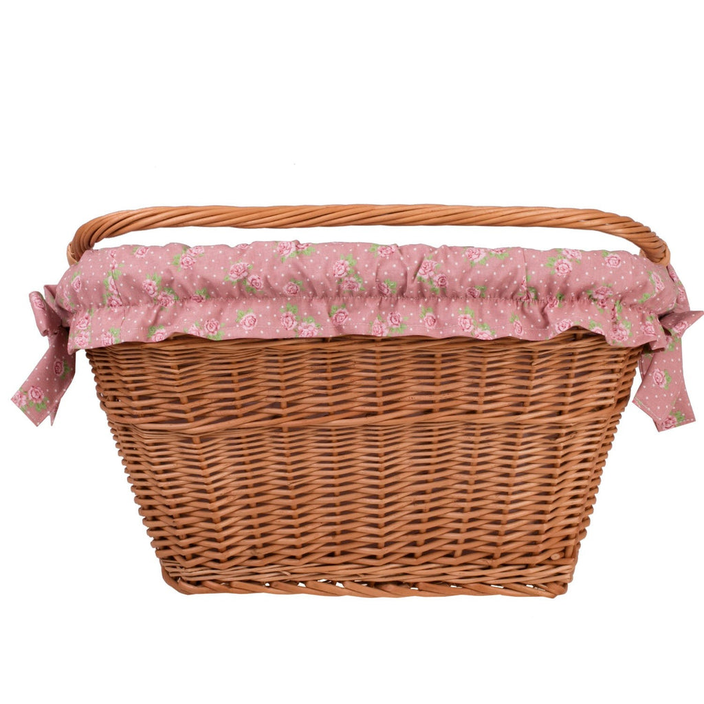 a functional willow bike basket with its cotton liner shown in detail, ready for a practical family outing