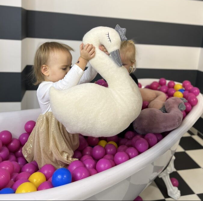 confident handmade swan soft toy with a shimmering crown and beak