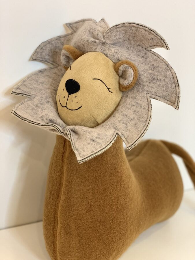handmade lion pillow in regal brown felt, elegantly detailed for a sophisticated nursery