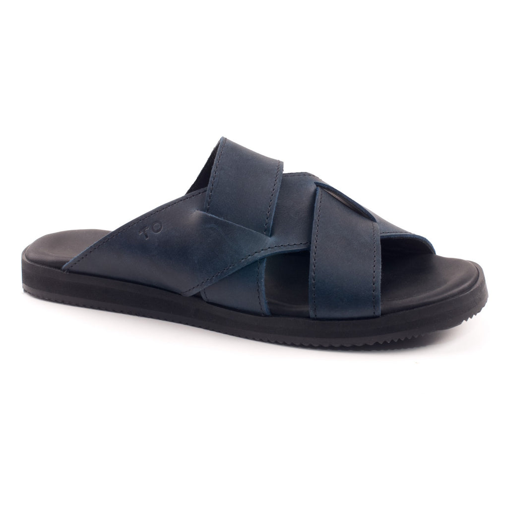 soft navy leather helsinki sandals for her, side view showing flexible elastic strap and comfortable ergonomic insole