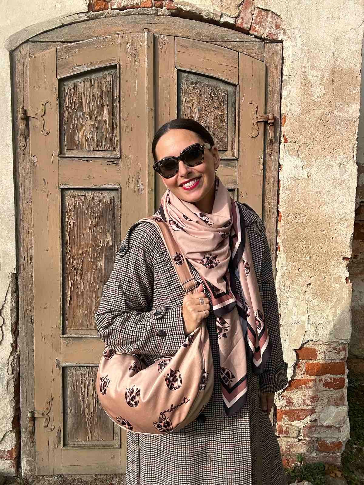 bold brown leopard tulip hobo bag in dramatic studio lighting showcasing its chic velour texture