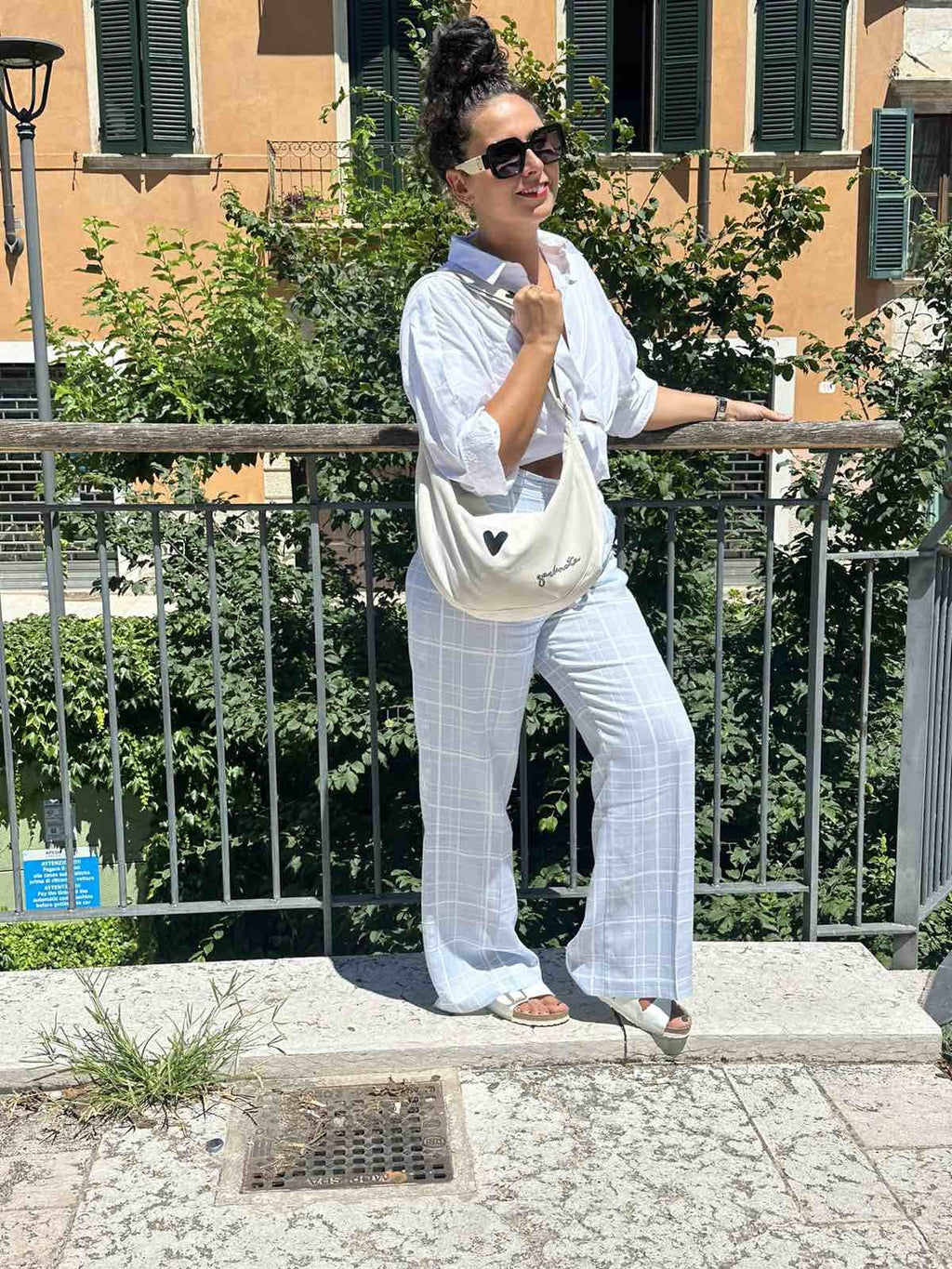 soft white velour hobo bag heart held gently in warm morning light