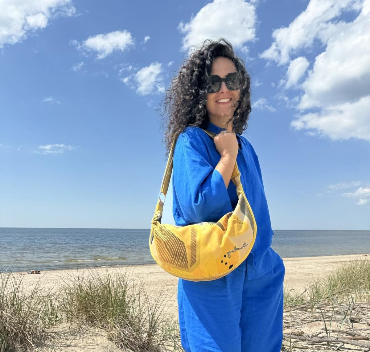 bold statement lemon yellow velour hobo bag in dramatic studio lighting