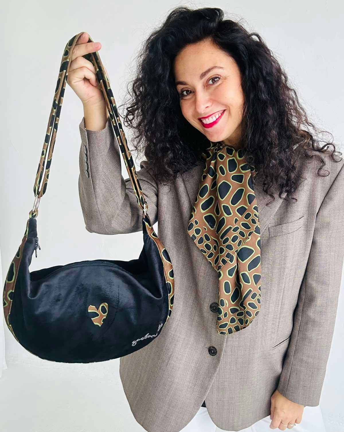 soft velour leopard heart hobo bag with a comforting slouch, shown in warm morning light