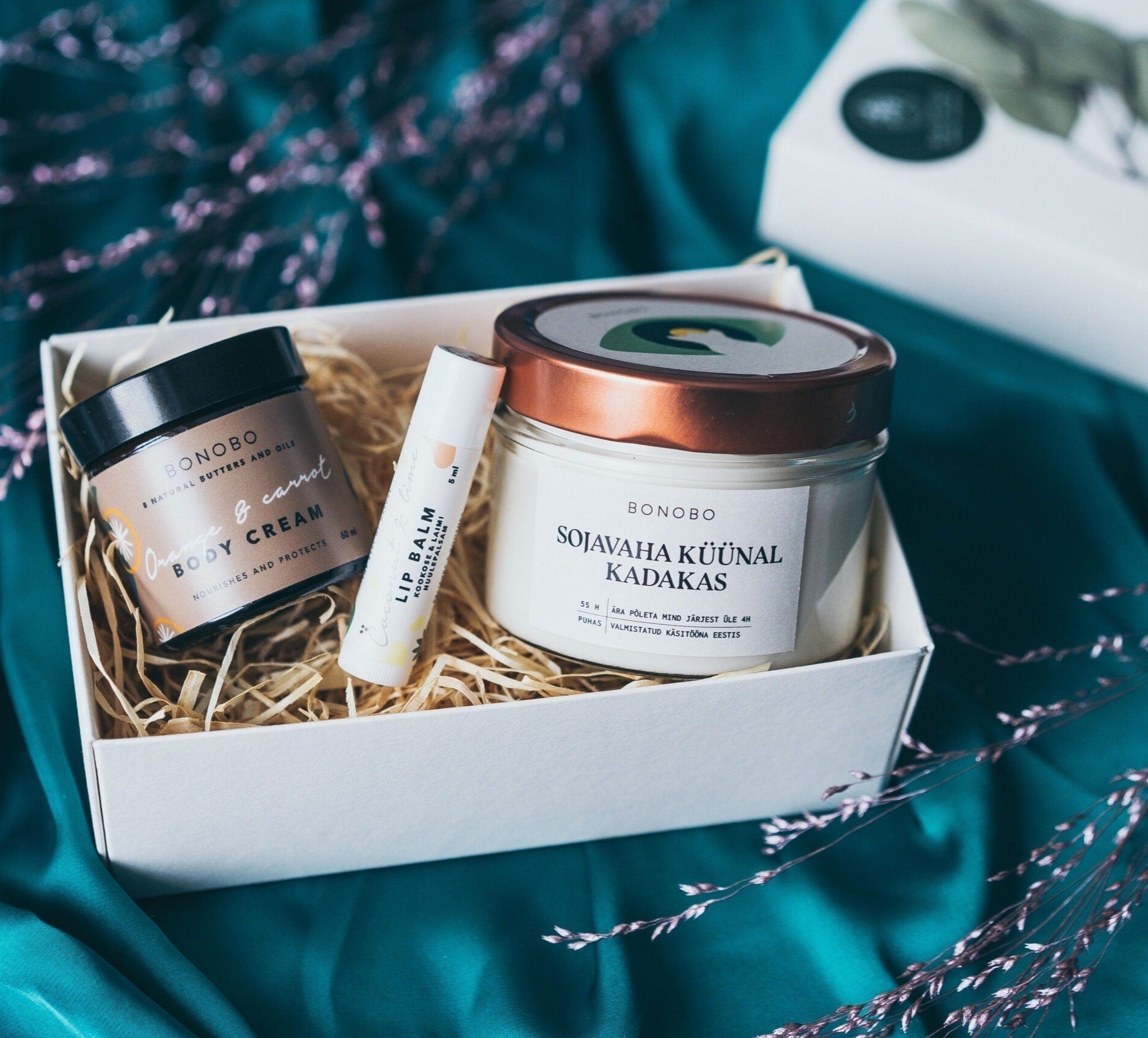 bold presentation of the i see you gift box with juniper candle and orange cream in dramatic lighting