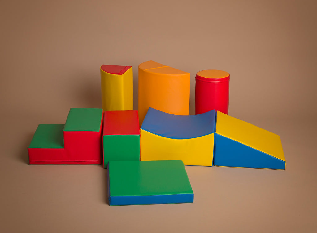 a child building a sturdy obstacle course with soft iglu blocks for active play