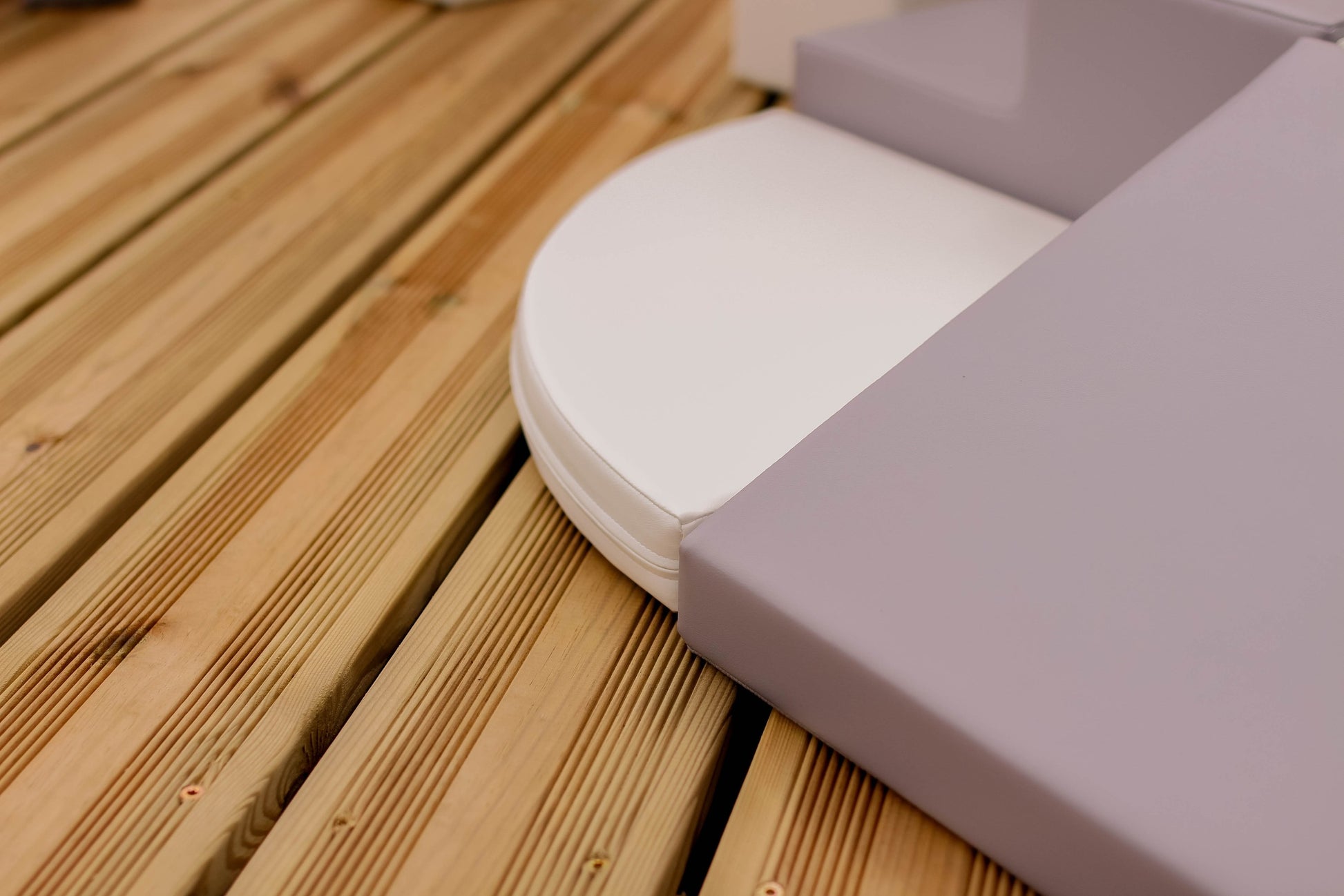 a soft grey and white iglu foam block set arranged in a gentle, inviting stack for a nursery