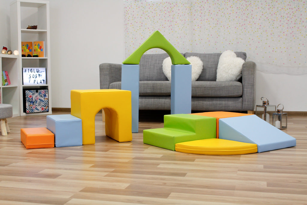 a soft iglu foam block set arranged in a gentle, comforting pyramid for creative play