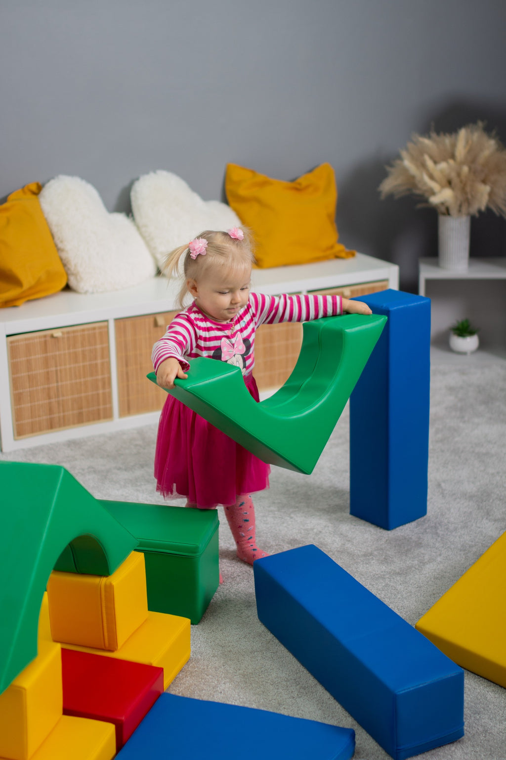 elegant arrangement of soft multicolor foam blocks for a refined nursery play space
