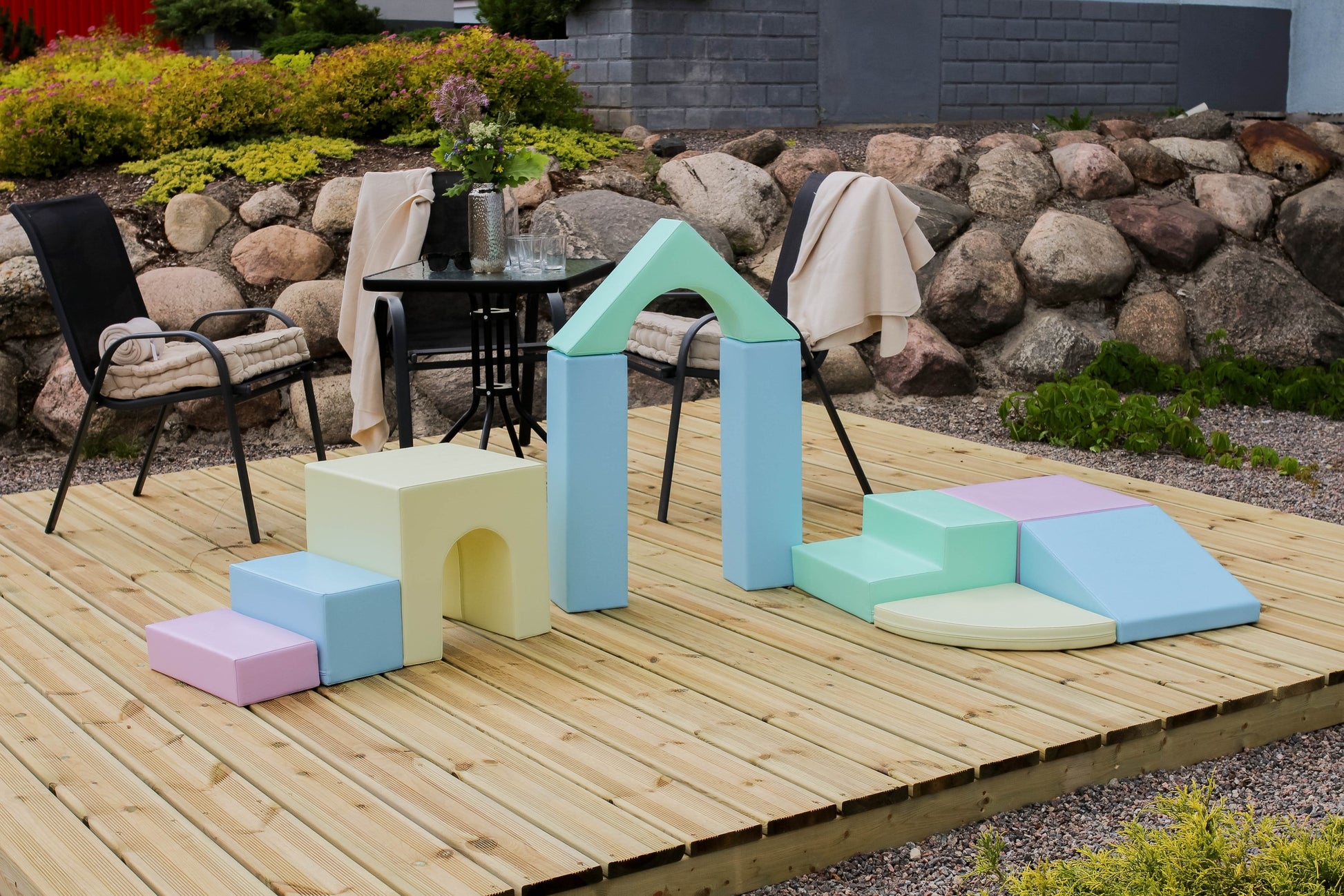 a soft pastel iglu foam block set arranged in a gentle, inviting stack for creative play