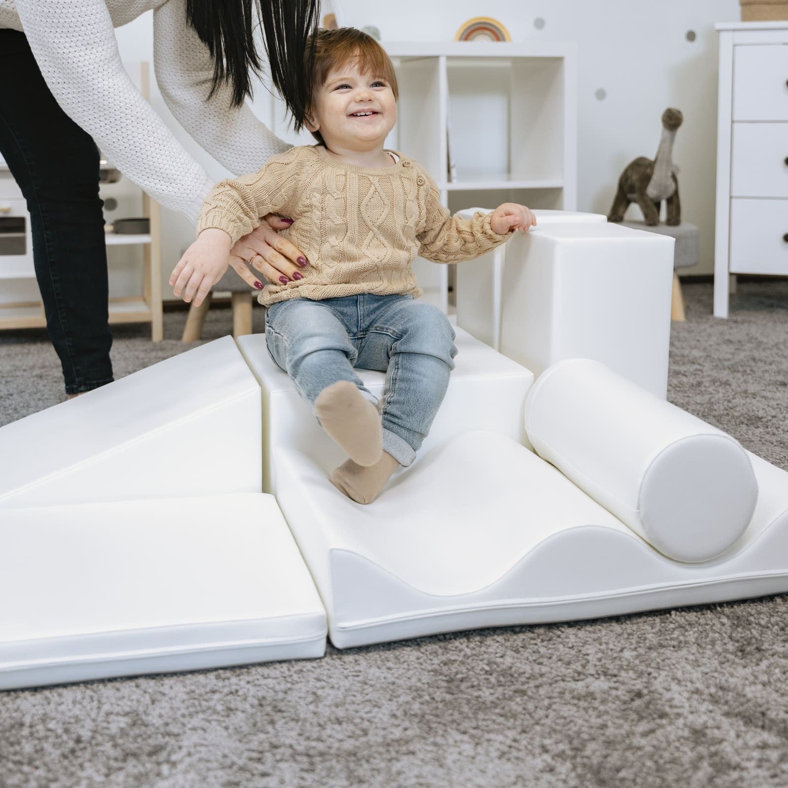 a child building a creative igloo fort with white iglu foam blocks