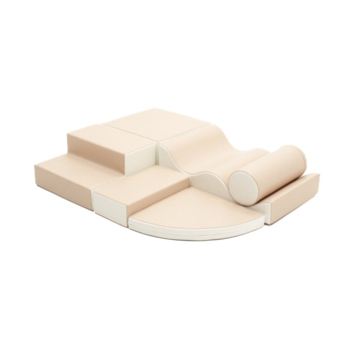 a soft beige foam ramp and corner piece from the iglu explorer set arranged in a cozy play nook