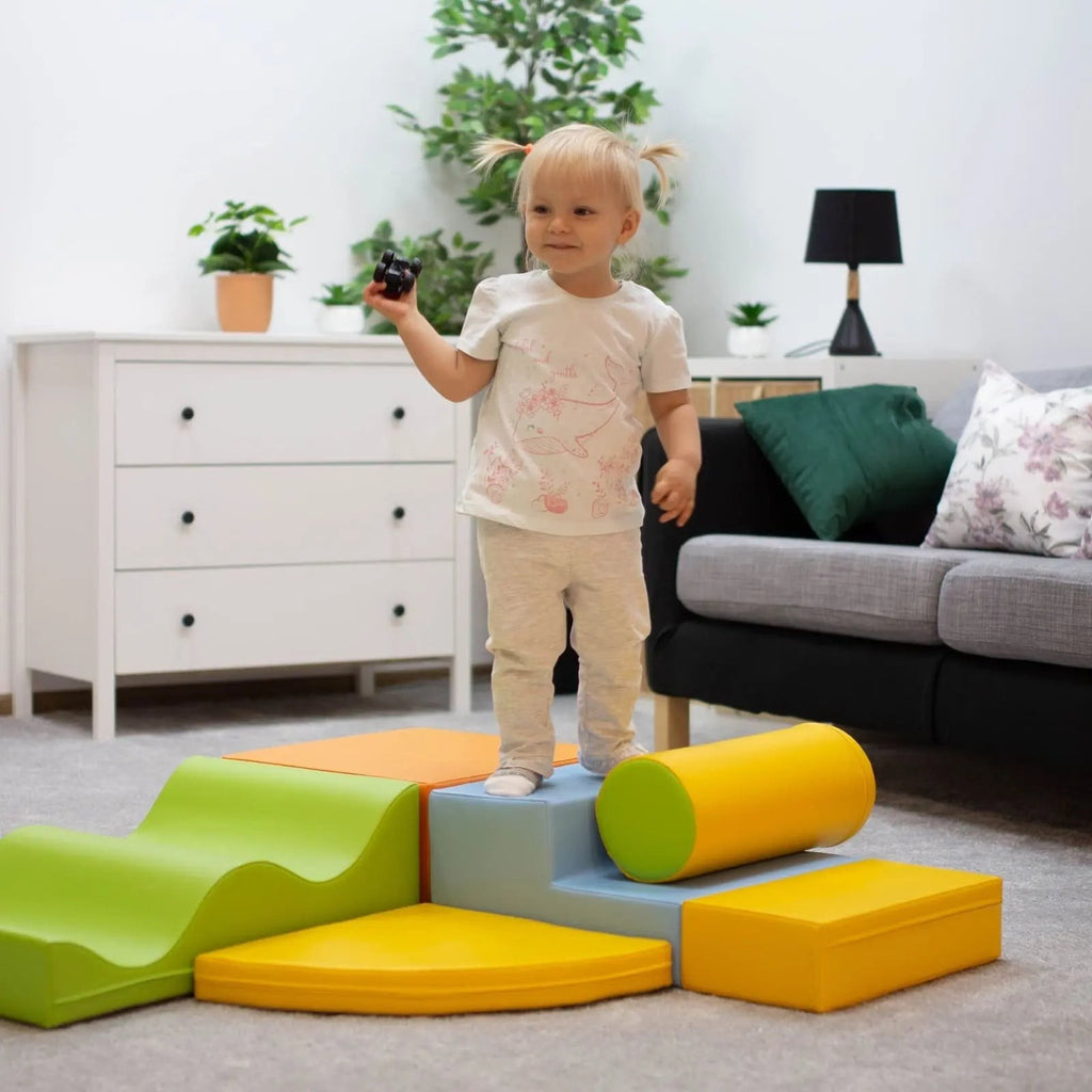 a soft multicolor foam block set arranged in a gentle, cozy archway for a child's quiet hideaway