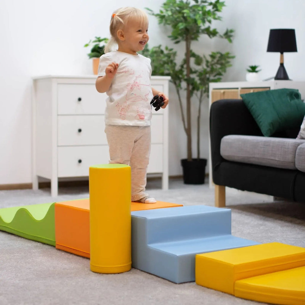 a toddler building a magical forest hideaway with soft multicolor iglu foam blocks