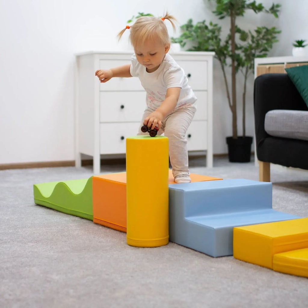 a toddler building a vibrant iglu foam block castle in a sunlit playroom