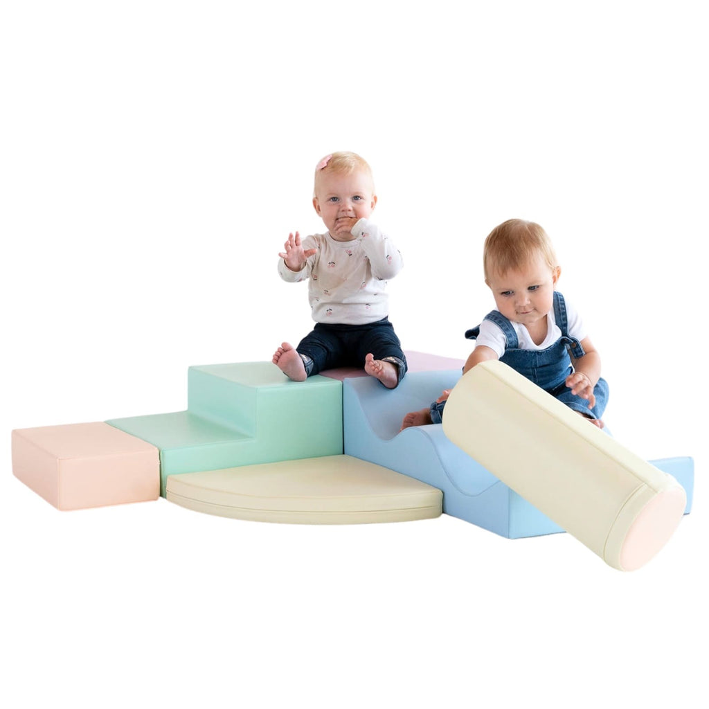 a soft pastel iglu foam block set arranged in a gentle, inviting nest for a toddler's cozy playtime