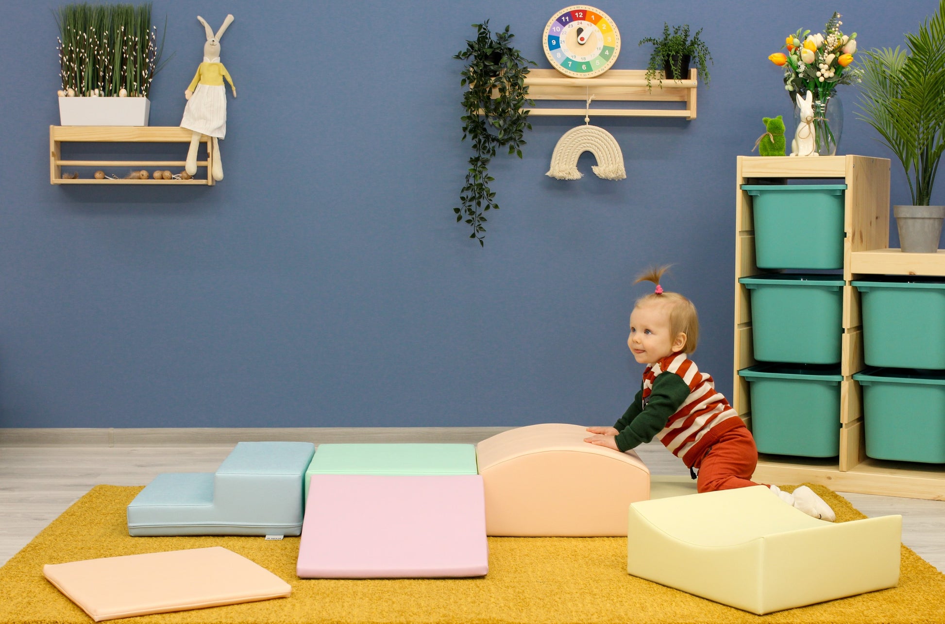 a toddler building a soft pastel igloo with eco-leather foam blocks