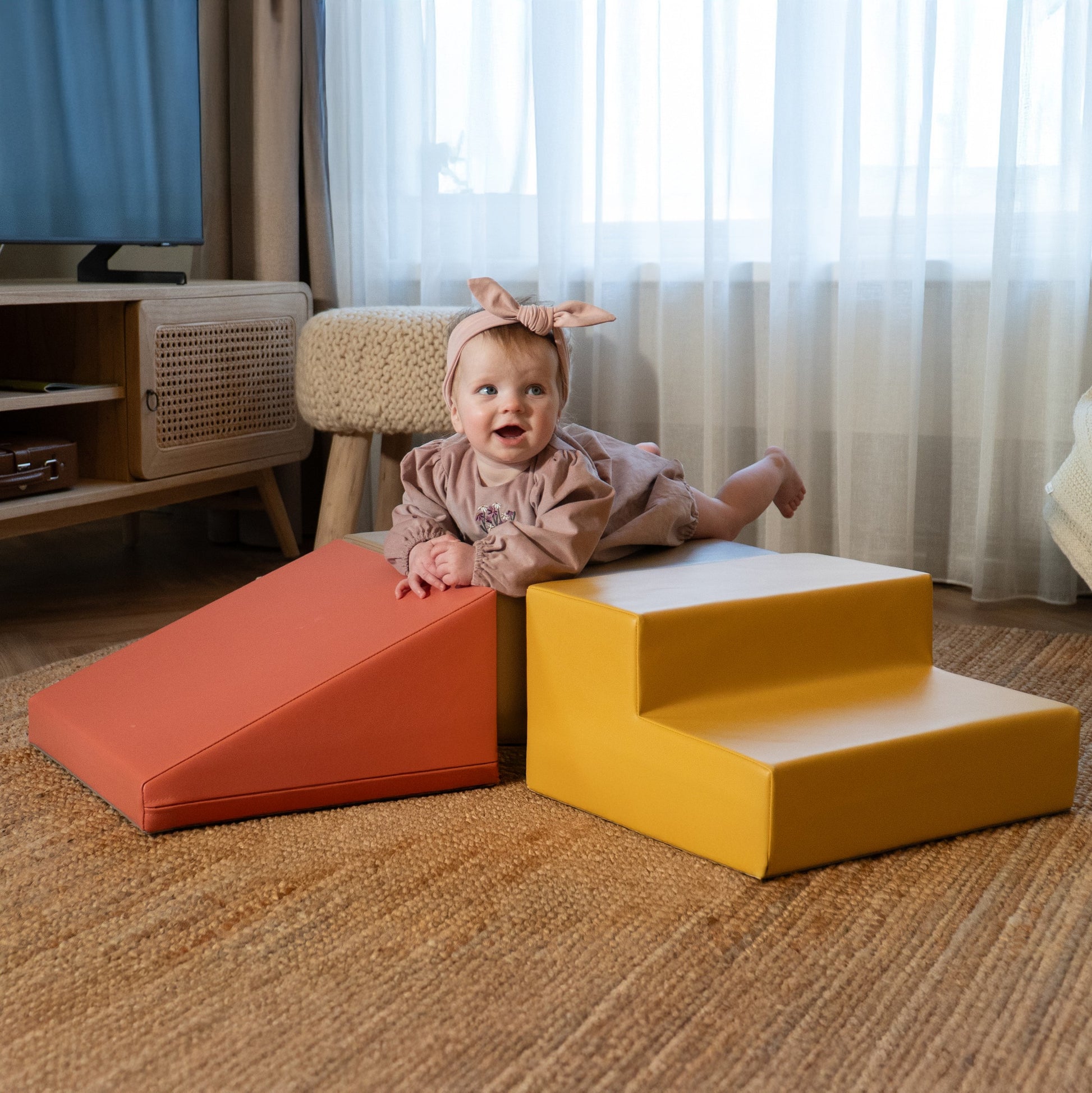 a bold arrangement of soft pink foam blocks for toddler climbing adventures