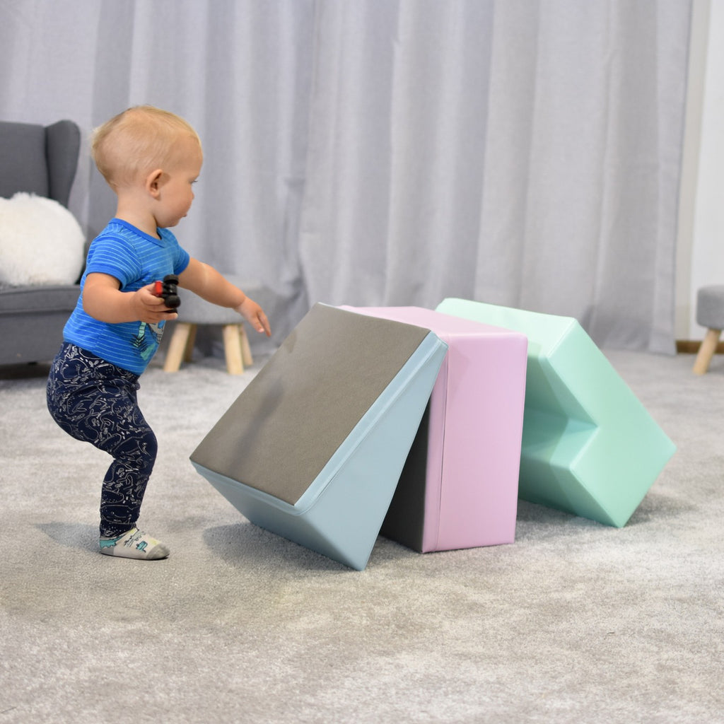 an elegant arrangement of pastel foam blocks in a minimalist, well-lit nursery setting
