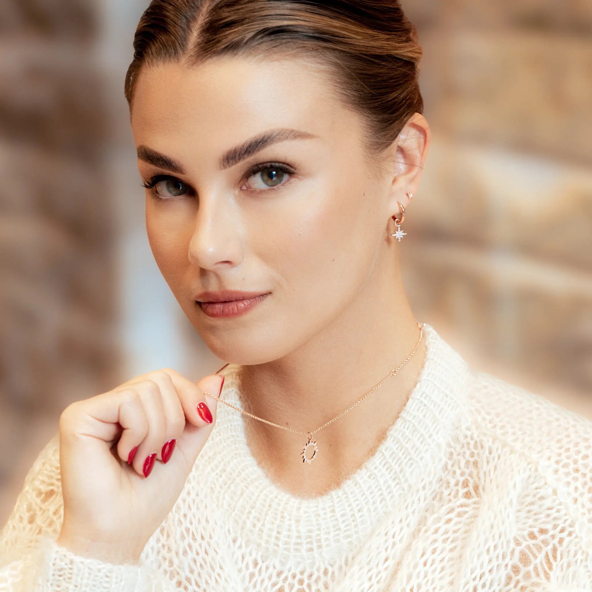 a soft close-up of sterling silver star earrings with a gentle sparkle, perfect for a baby gift