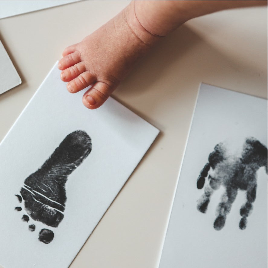 bold close-up of a crisp baby hand print captured mess-free in warm studio light