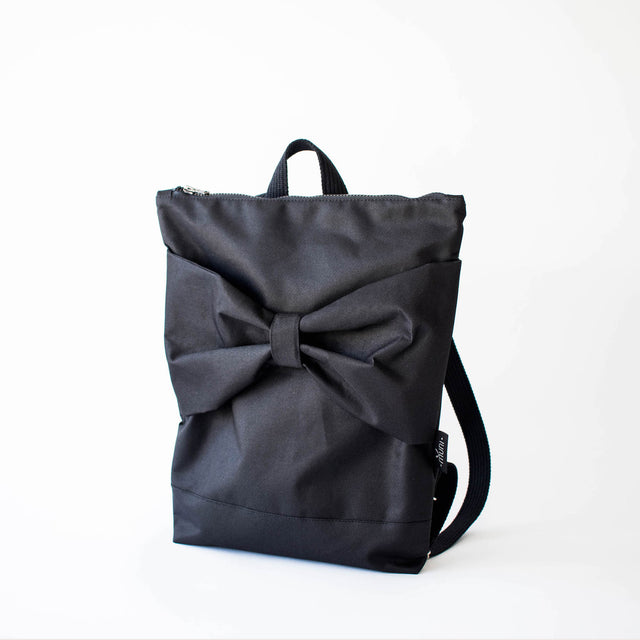 Elegant Black Bow Backpack - Waterproof & Organized by Muni at www.brixbailey.com