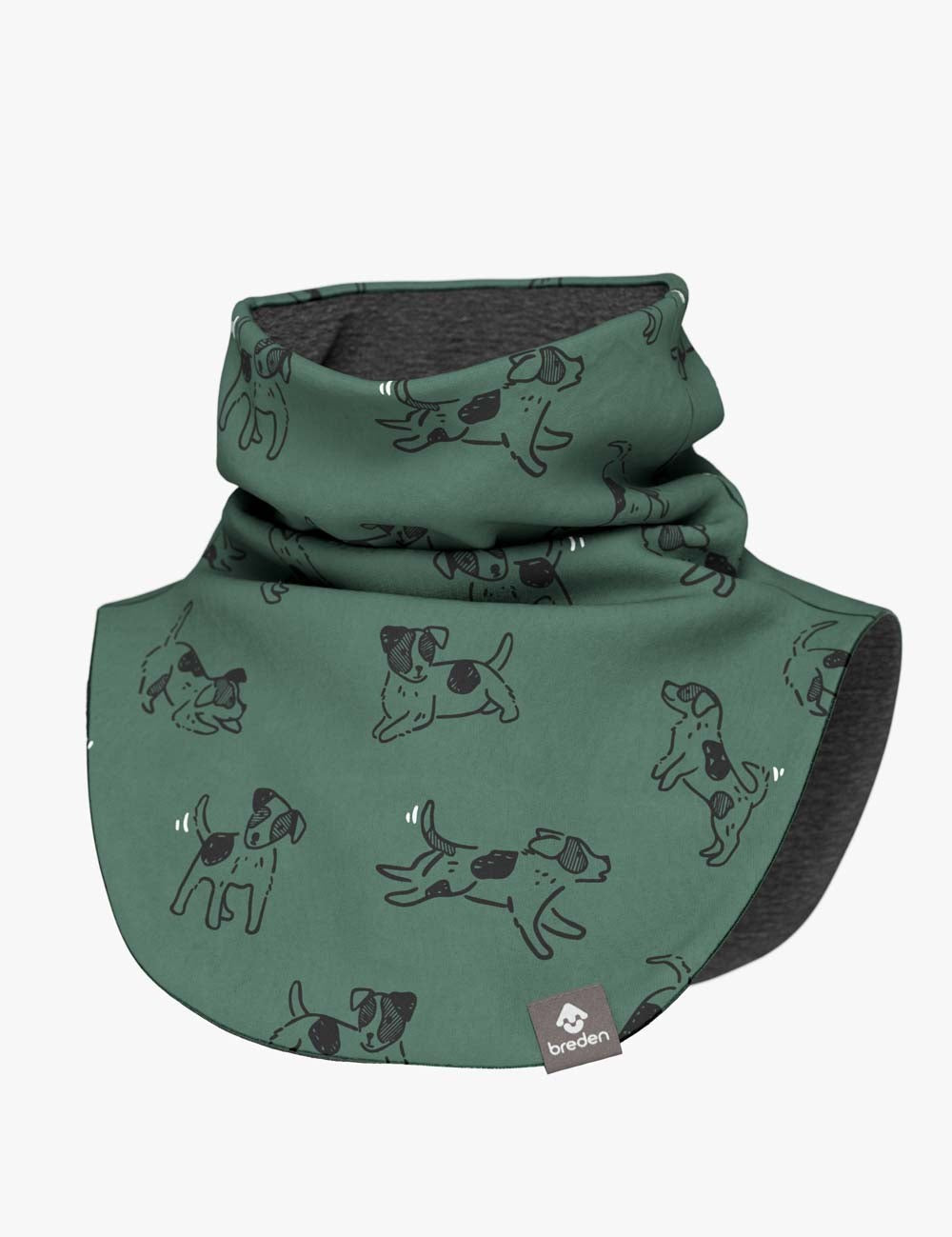 a child's green dogs merino neck warmer shown in soft, cozy indoor light