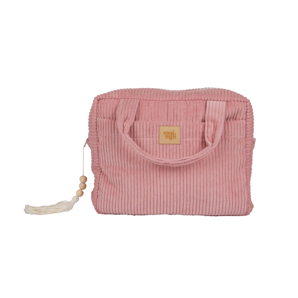 a practical large baby pink makeup bag open on a table showing its inner and outer pockets