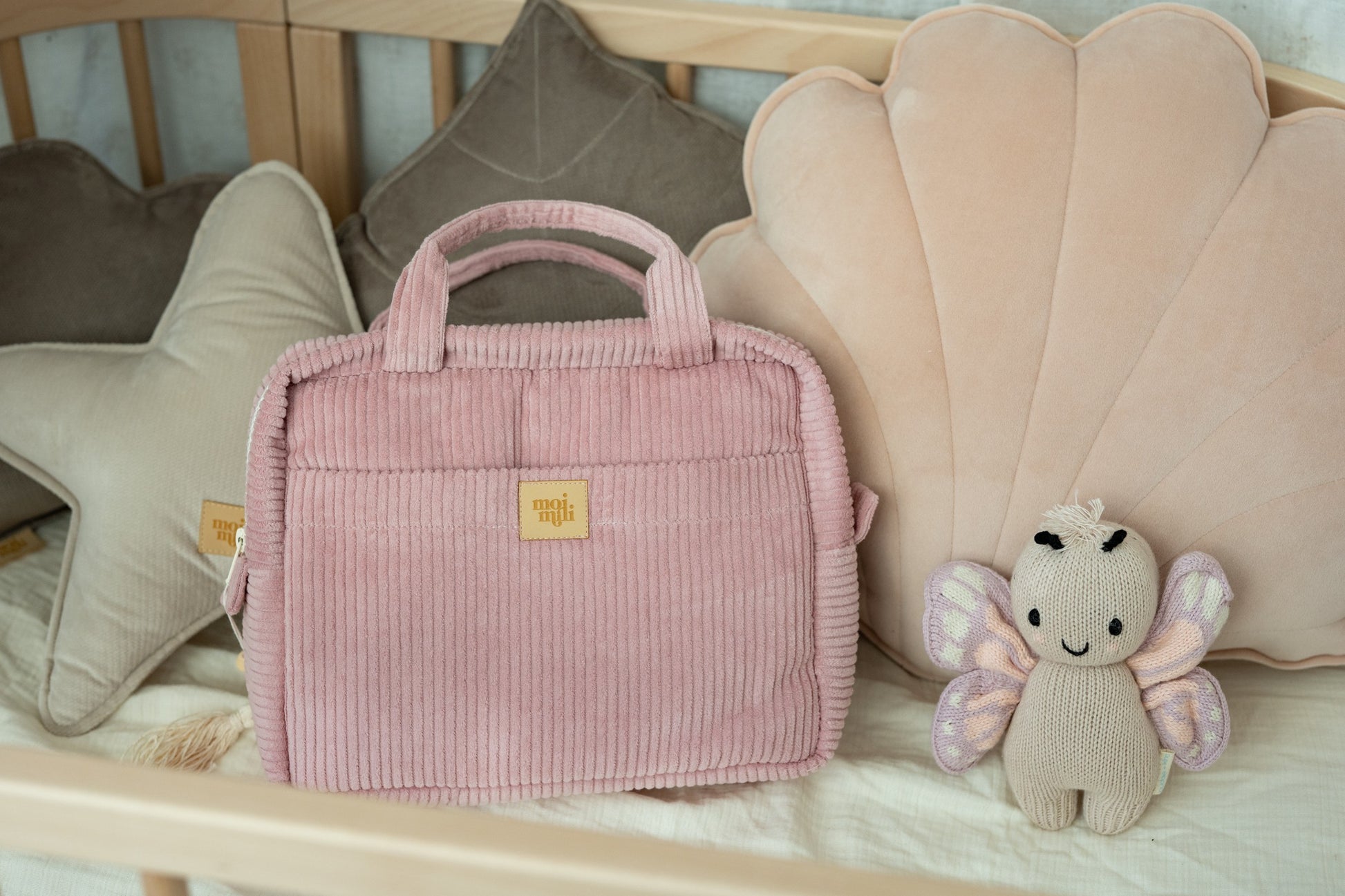playful baby pink cotton makeup bag set of two open on a sunny windowsill