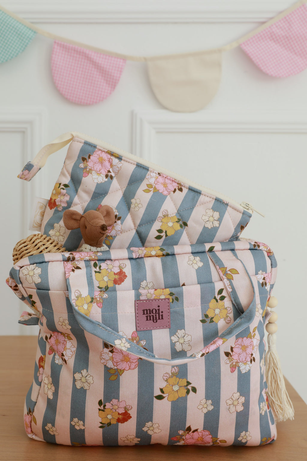 playful blue striped cotton makeup bag set open on a sunny windowsill