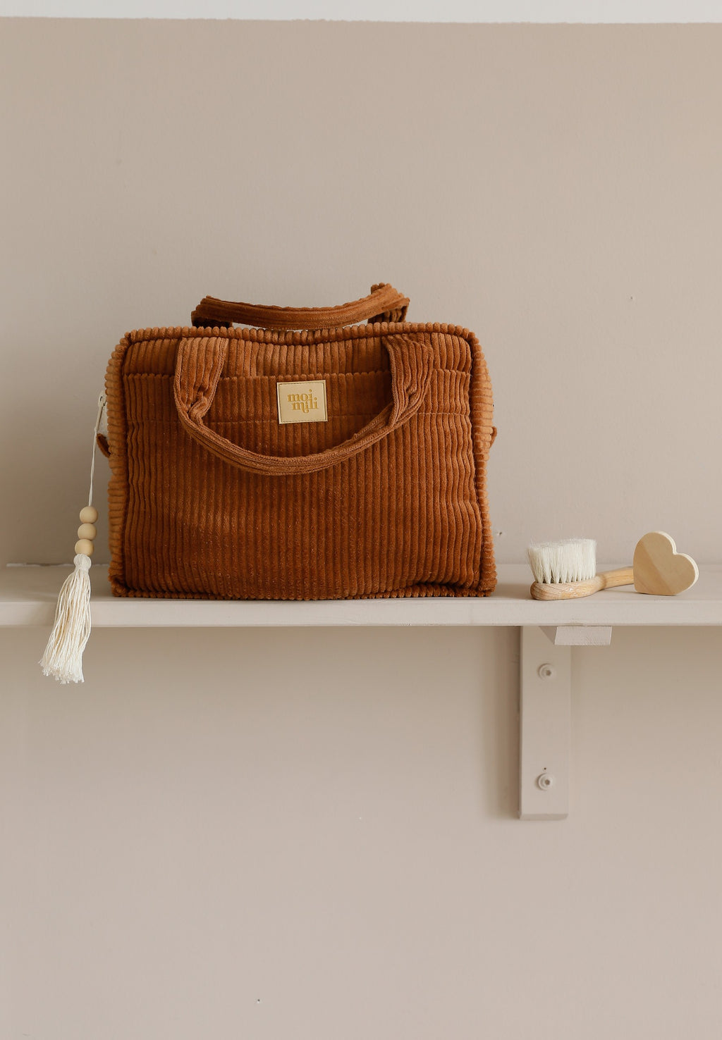 a close-up view of the handmade caramel makeup bag's outer pocket and cotton texture