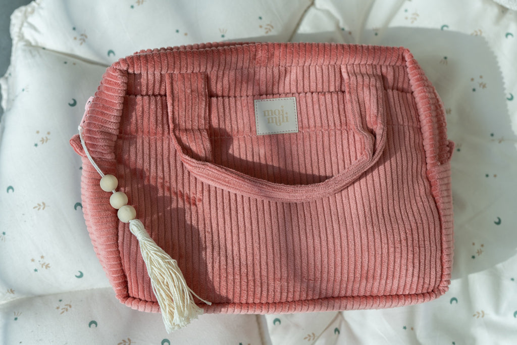 elegant coral makeup bag set with two sizes open to reveal inner pockets and waterproof lining
