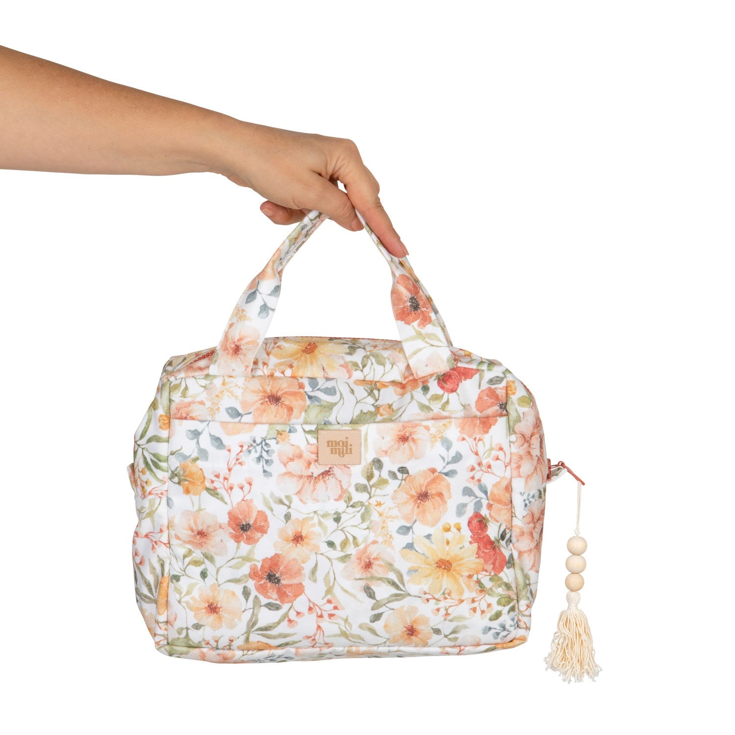 bold floral makeup bag set open on a marble surface showcasing its spacious interior and pockets