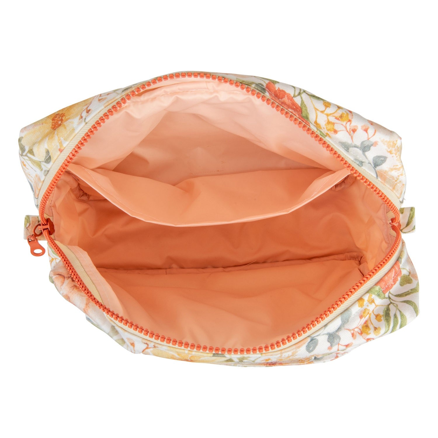 softly lit cotton makeup bag with a floral pattern resting on a cozy linen background