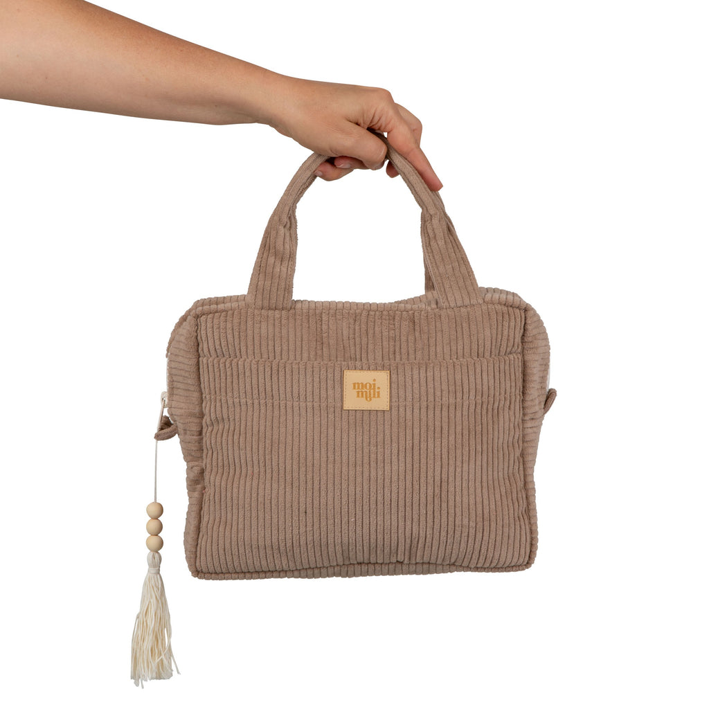 bold latte-colored makeup bag with waterproof lining, open to show spacious interior and pockets
