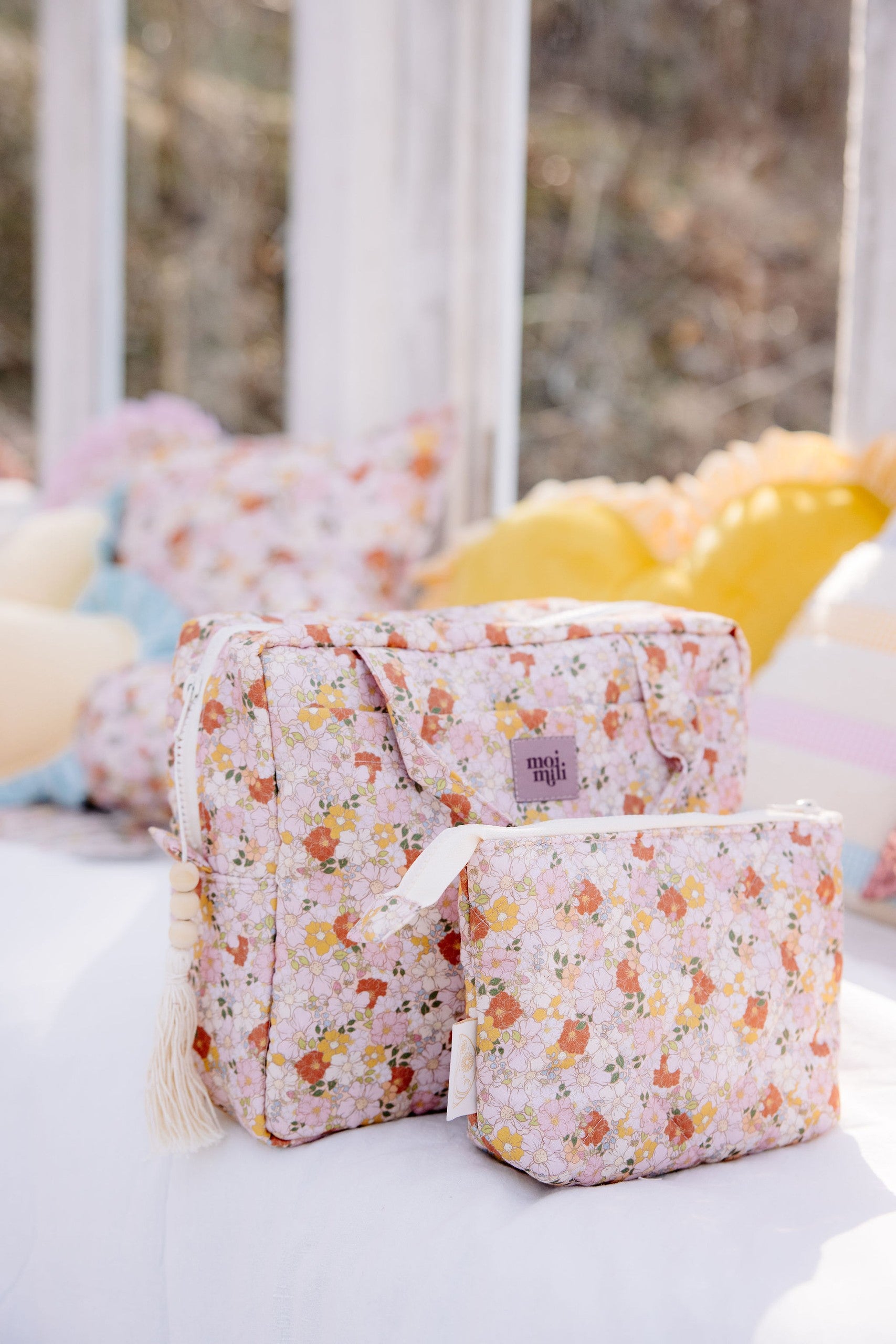 bold spring garden makeup bag with floral print, open to show spacious waterproof interior and pockets