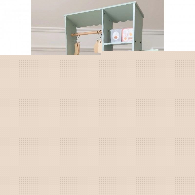 functional view of the woopie green food truck's card reader and scale setup on the wooden counter