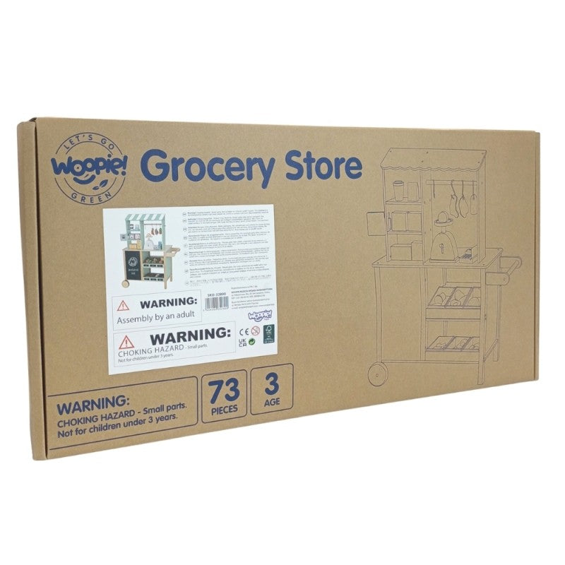 a child's hand using the woopie green wooden food truck's card reader during a sunny afternoon play session