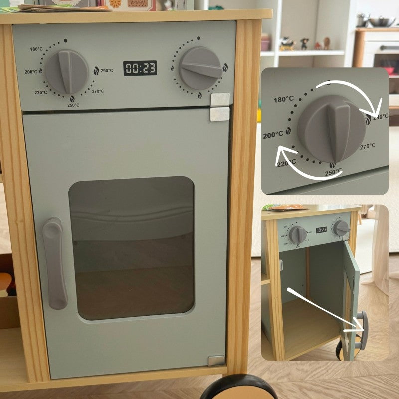 a child's hand using the wooden card reader at the woopie green food truck stand