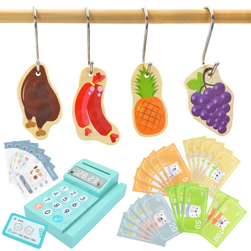 a child's hand using the woopie green food truck's wooden card reader during a sunny afternoon play session
