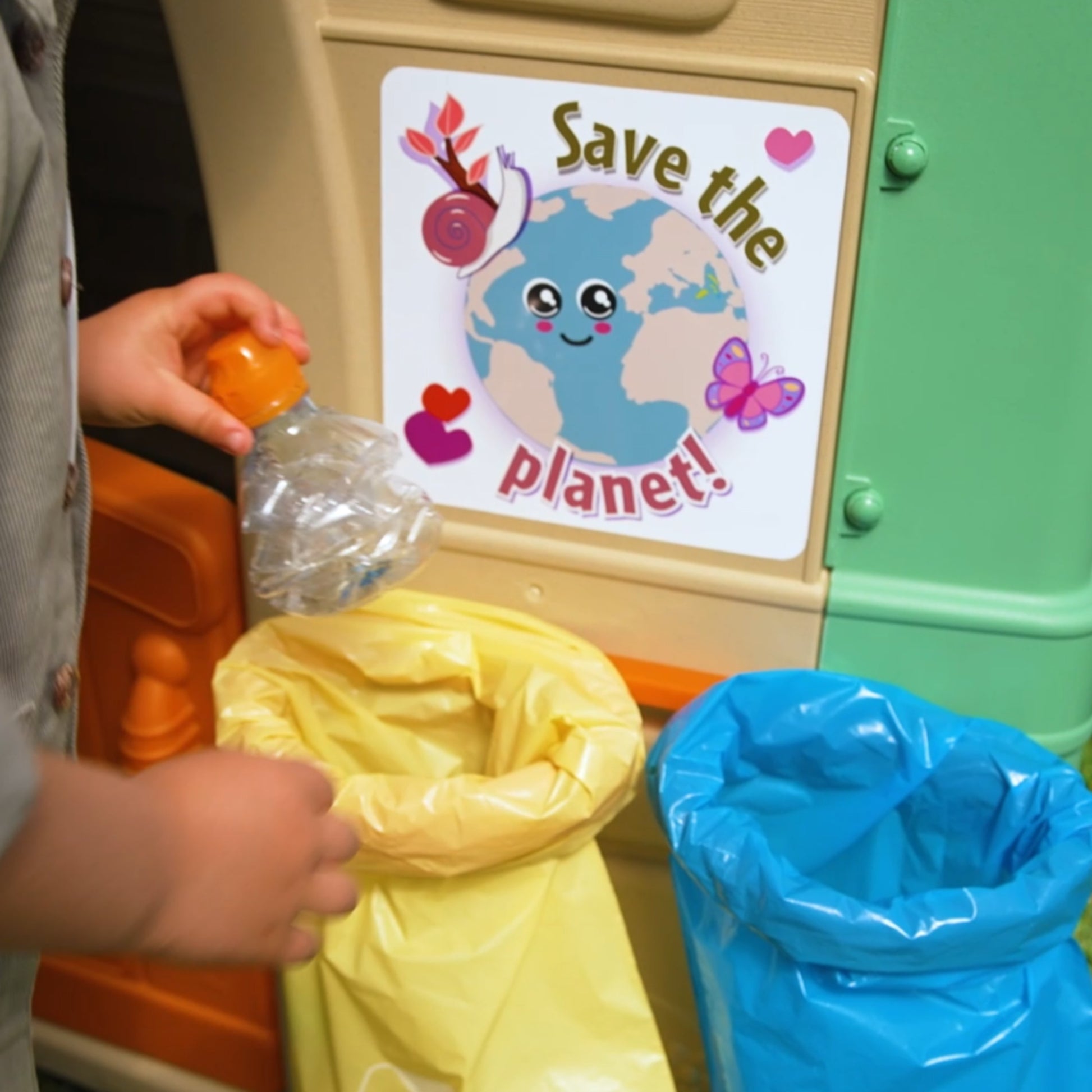 kids playing in a recycled eco playhouse with wind turbine and solar panels under sunny skies
