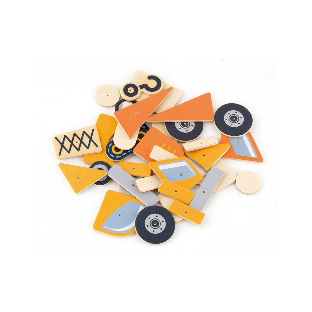 child hammering wooden construction vehicle pieces into cork board with pastel-colored blocks and pins