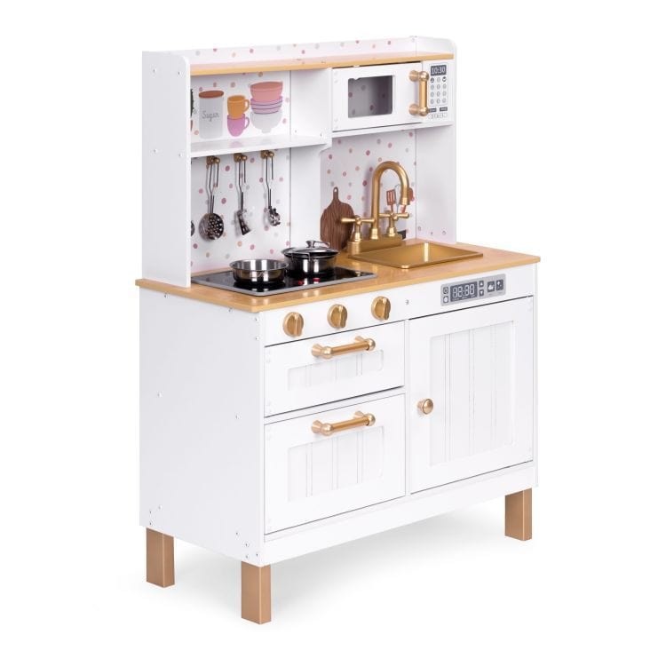 a child's hands turning the knobs on a wooden play kitchen, igniting the sizzling sound effects