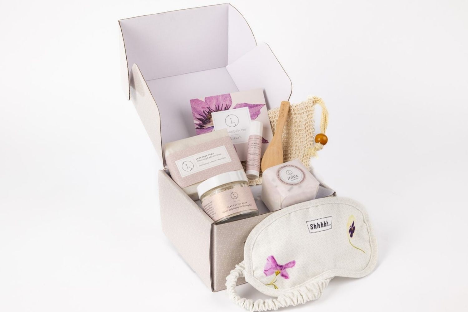 bold hero shot of the complete lavender bath and body gift set on a dark slate background